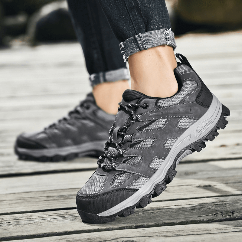 Breathable non-slip hiking shoes for men with laces SF1411 on a wooden deck, perfect for rugged outdoor adventures.